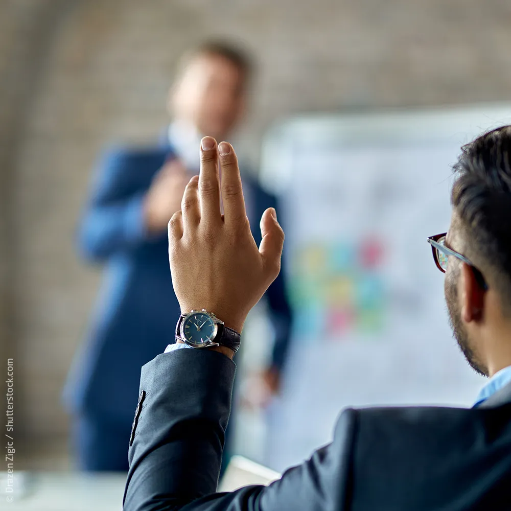 Meeting Eigentümerversammlung Handzeichen